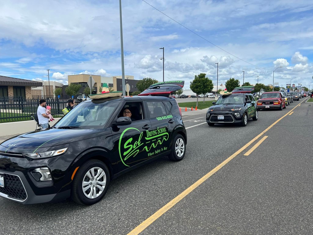 SOL Driving School vehicles in community parade